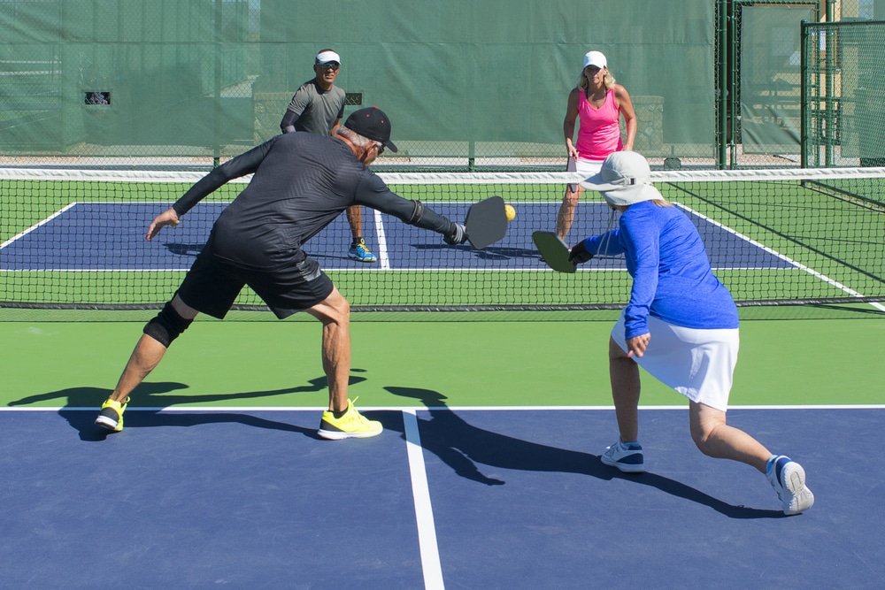 A view of people playing pickleball doubles