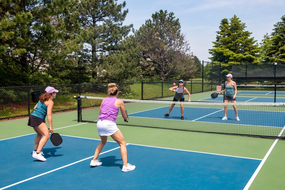 A view of people playing pickleball in a court