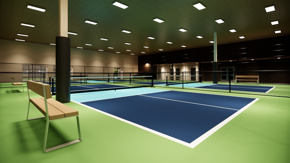 Image Of An Indoor Pickleball Court Featuring Blue And Green