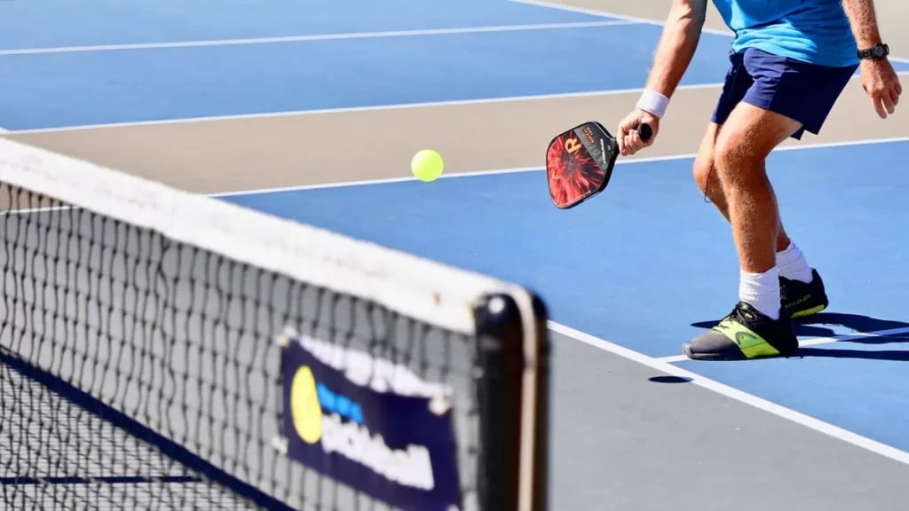 a palyer is palying pickleball game