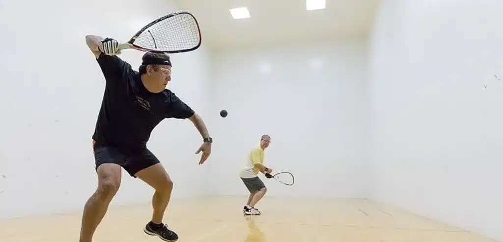 A view of a person hitting a backspin return serve pickleball shot