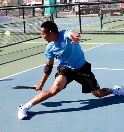 A view of a person hitting a backhand dink shot