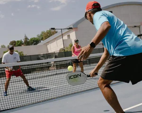 A view of guys playing a match of pickleball