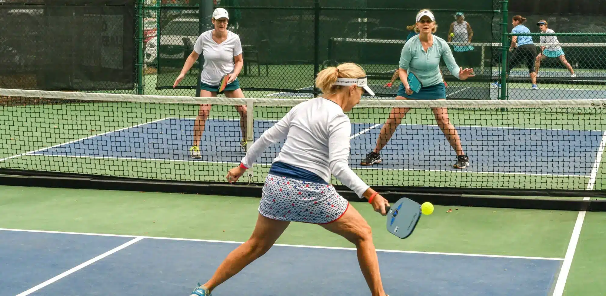 A view of two men playing pickleball