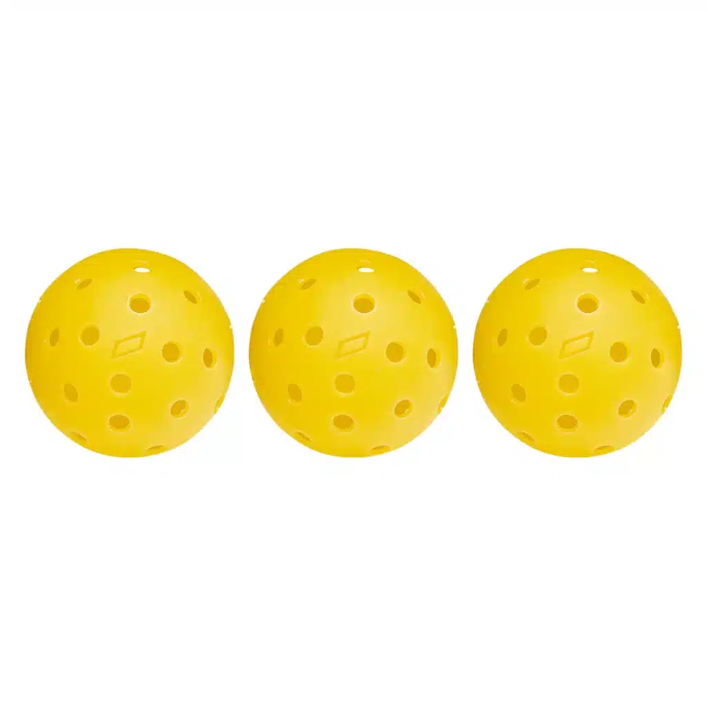 A view of three yellow pickleballs