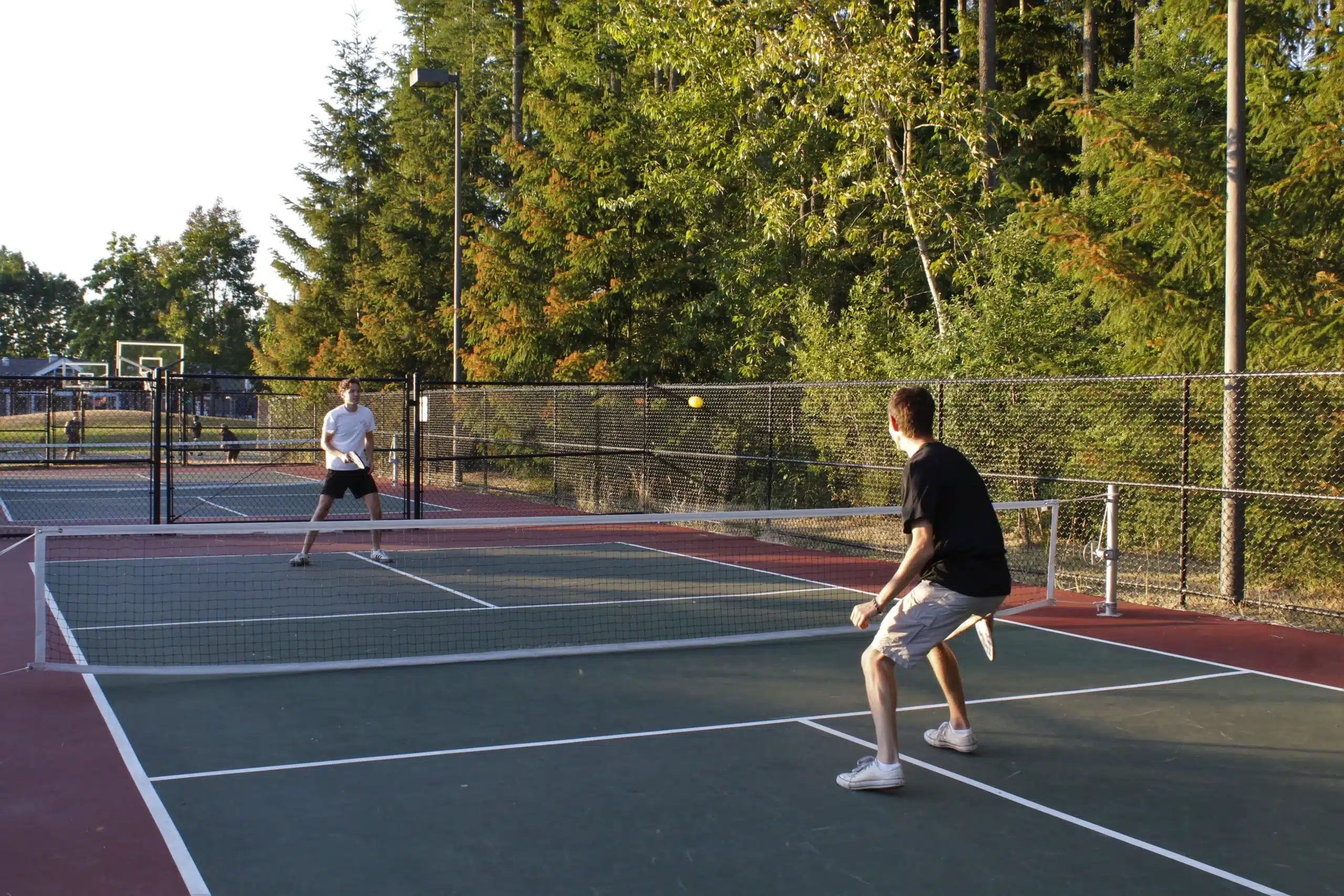 A view of two men playing pickleball