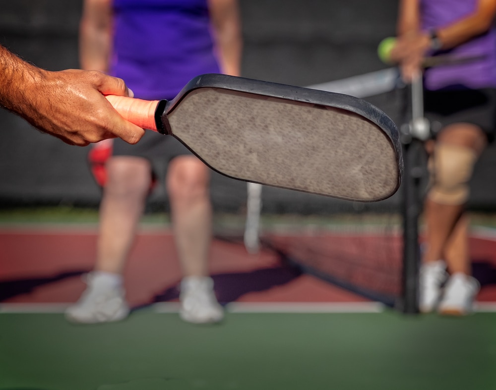 A view of a person a pickleball paddle