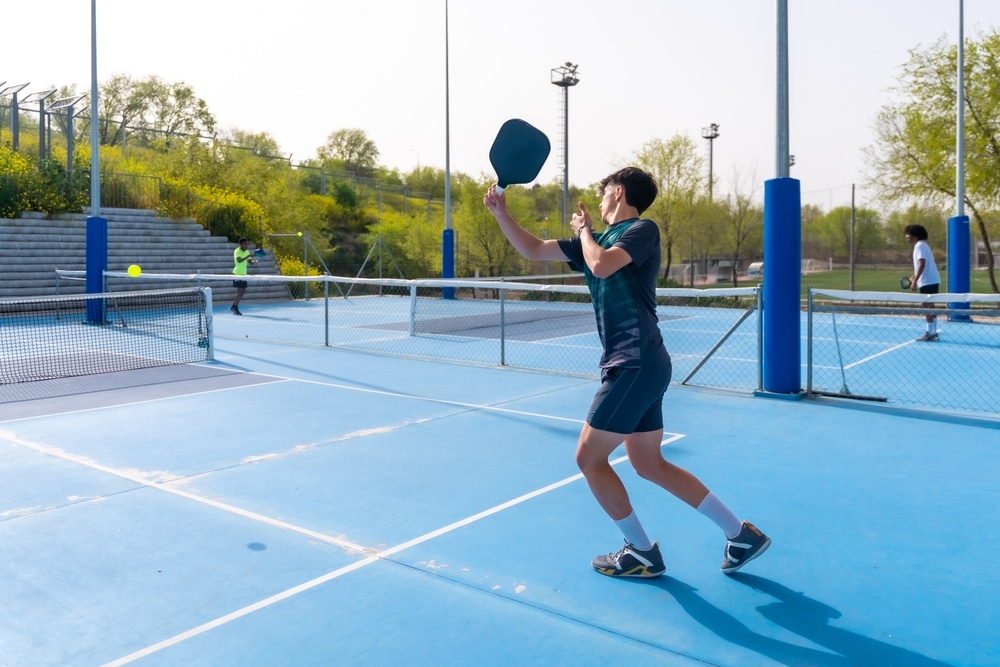 A view of people playing pickleball court