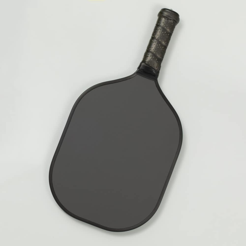 A view of a grey pickleball paddle