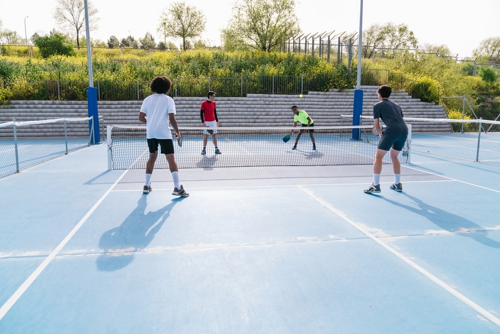 A view of people playing at a pickleball court